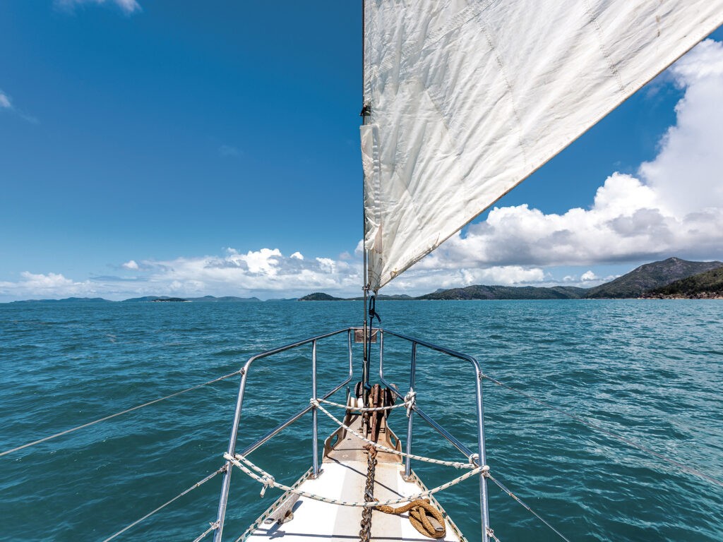 Sail boat on open water around the whitsunday islands in Australia