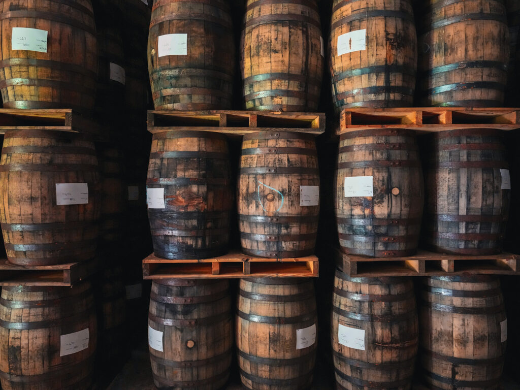 Stacks of wooden barrels filled with aging Puerto Rican rum