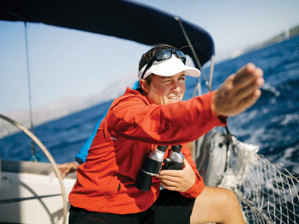 woman executing safe boathandling with her sail boat