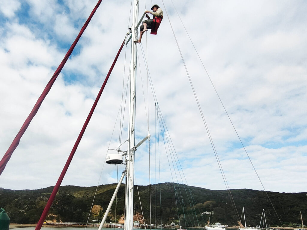 Man climbing up the mast