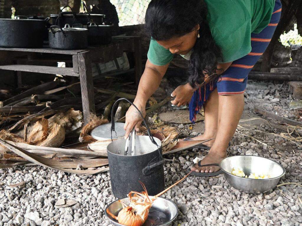 Women cooking lobster
