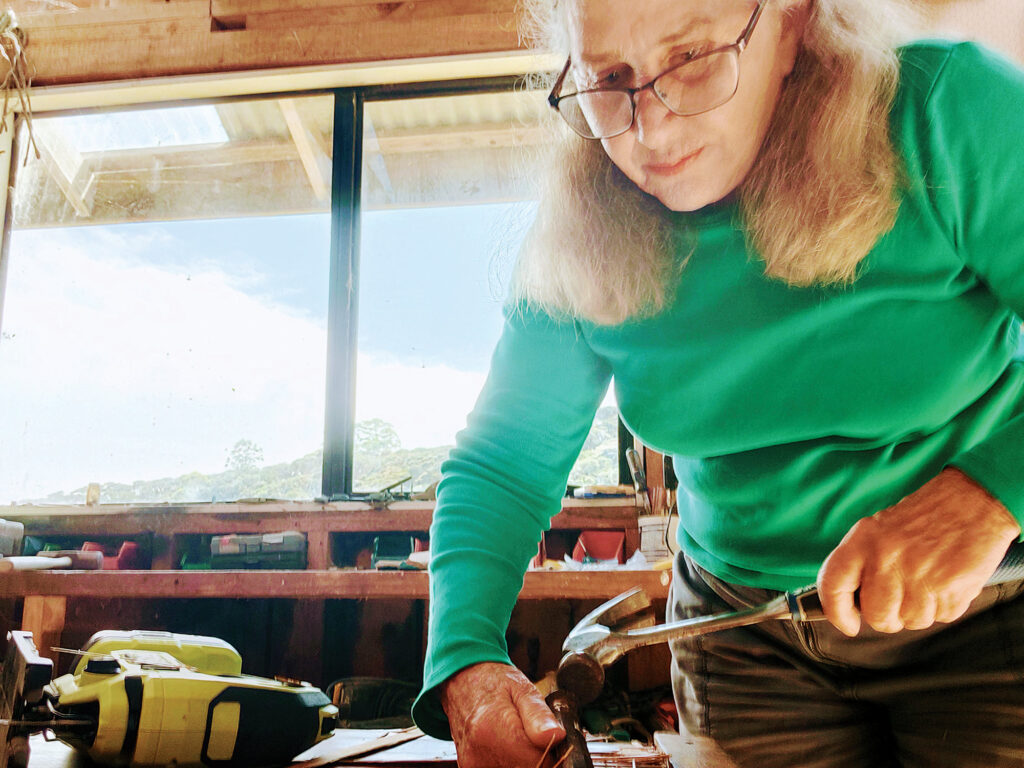 Lin Pardey working on David's boat, Sahula