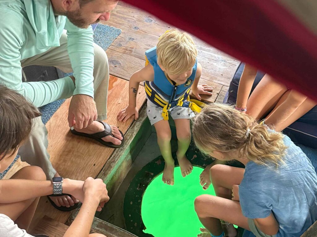 Family around a dive hatch