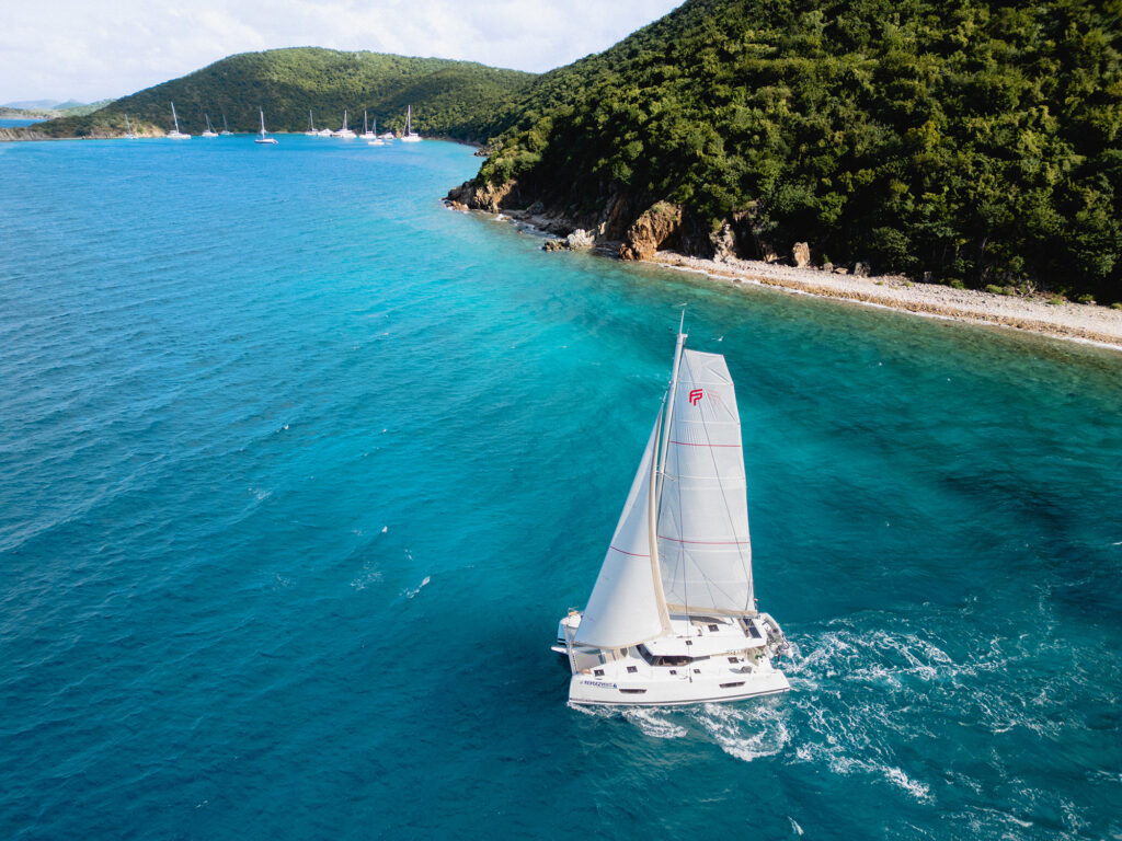 Drone view of a catamaran in a lagoon