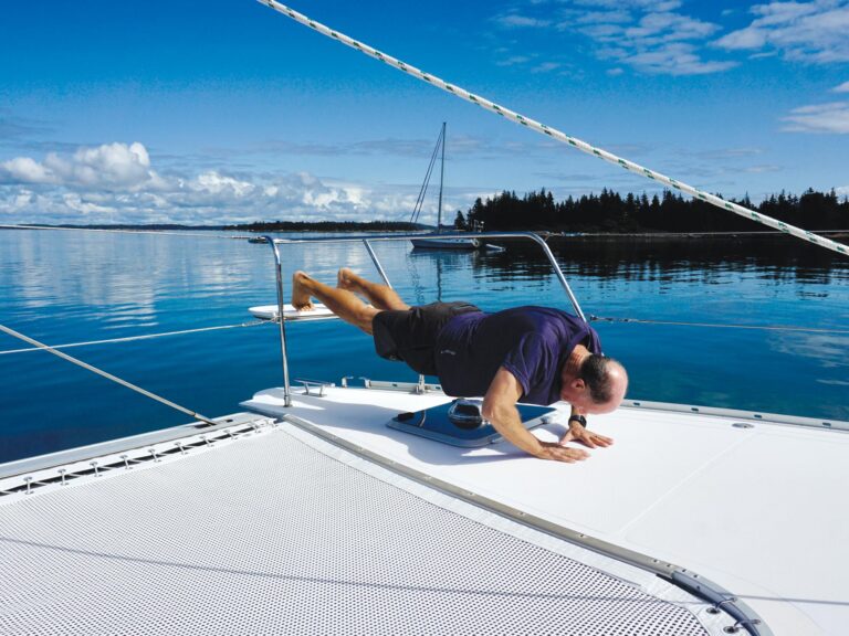 Man exercising on a sailboat