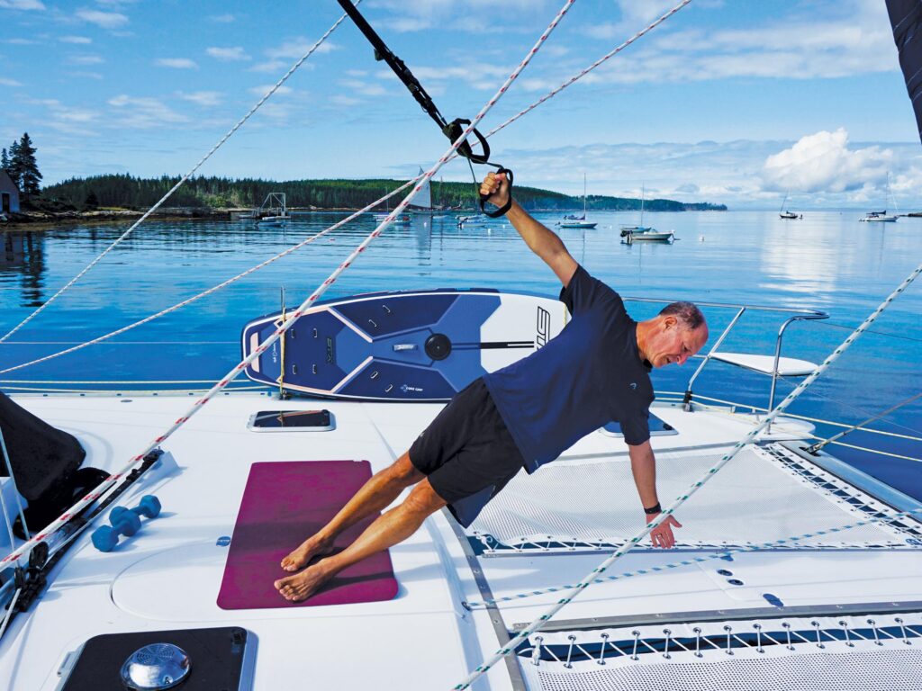 Man exercising on a sailboat